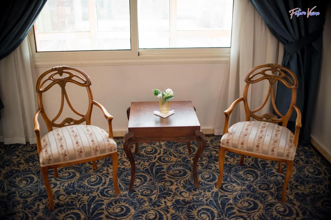 Rehana Plaza Hotel Cairo Exterior photo A pair of armchairs